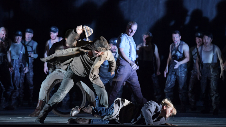 Peter Marsh (Shabby one; foreground left), Julia Dawson (Axinya; on floor), Dmitry Golovnin (Sergey; in background) & chorus